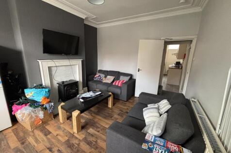 A spacious and well-maintained living room feat...