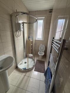 A clean, well-maintained bathroom featuring a s...