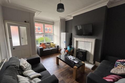 Bright and cozy living room featuring comfortab...