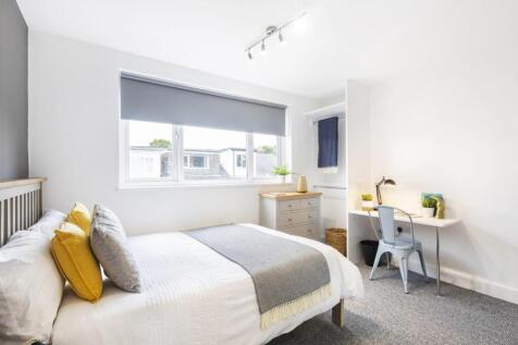 Bright, neatly presented bedroom with a double ...