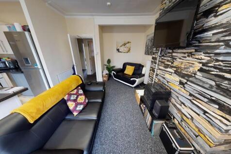 A modern and well-lit living room featuring a c...