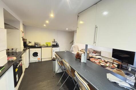 Modern and well-organized kitchen equipped with...