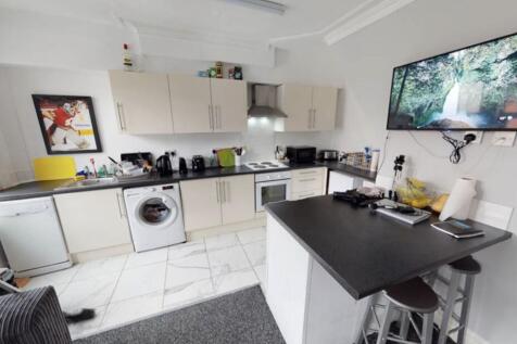 Bright and modern kitchen featuring ample works...