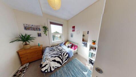 Bright and inviting master bedroom featuring a ...