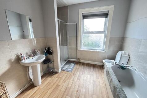 Bright and well-maintained bathroom featuring a...