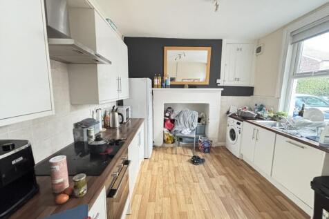 Bright and functional kitchen with ample counte...