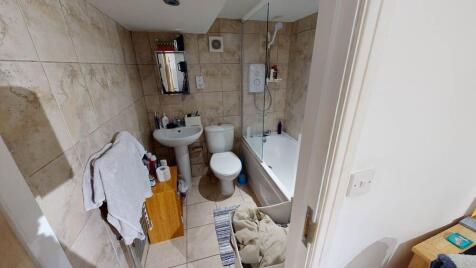 A clean and functional bathroom featuring a bat...