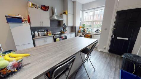 Bright and well-maintained kitchen with ample c...