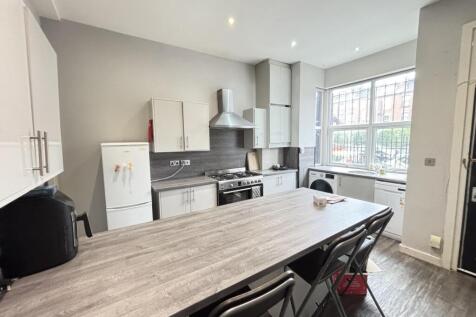 A bright and modern kitchen with ample natural ...