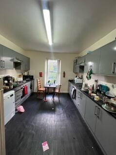 A well-lit, modern kitchen with ample cabinetry...