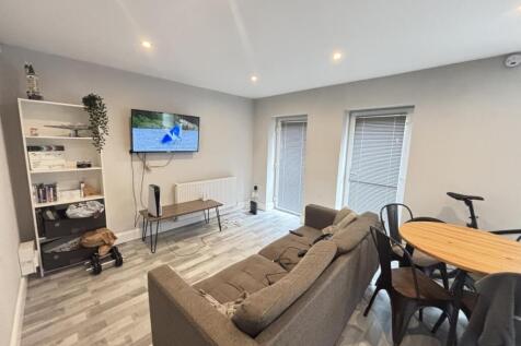 A bright and airy living room featuring modern ...