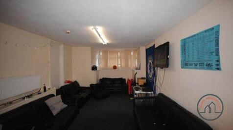 A spacious living room with comfortable seating...