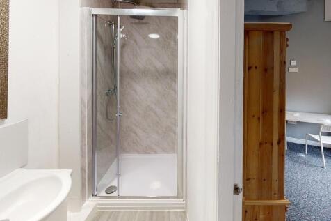 A clean and well-maintained bathroom featuring ...
