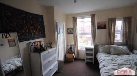 Bright and inviting living room featuring ample...