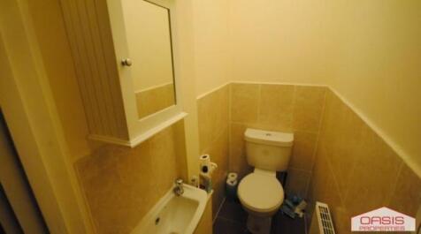 A clean and functional bathroom featuring a toi...