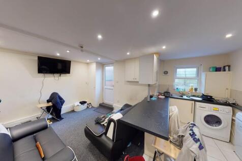 Bright and spacious living room featuring moder...