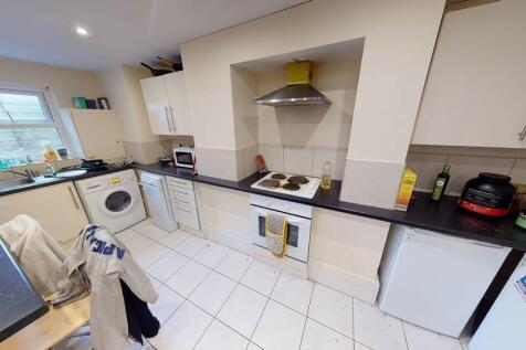 A bright, well-maintained kitchen featuring mod...