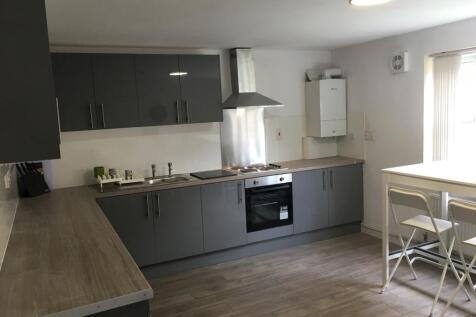 A modern and tidy kitchen with ample counter sp...
