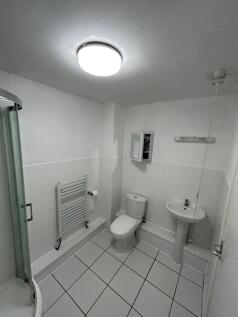 A clean and well-maintained bathroom featuring ...