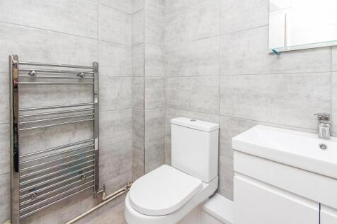 Bright, modern bathroom with contemporary grey ...