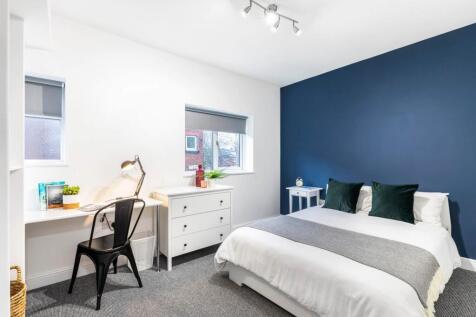 Bright, modern bedroom with a comfortable doubl...