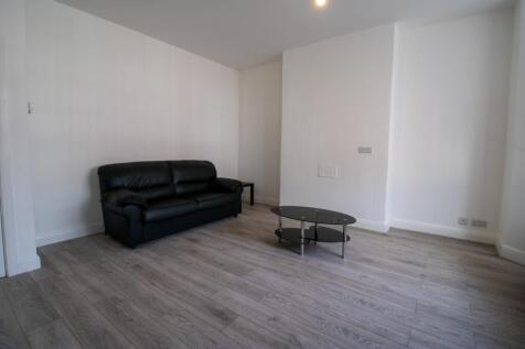 Bright, modern living area with contemporary wo...