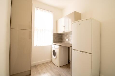 Bright, tidy kitchen with integrated storage, t...