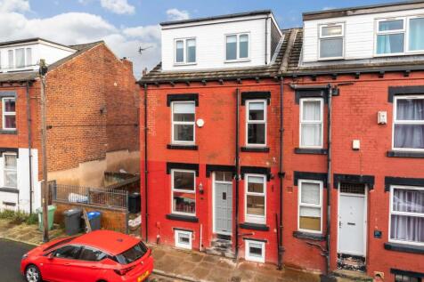 Bright red terraced house with a modern entranc...
