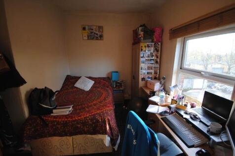 Cosy double bedroom with a fitted bed, bedside ...