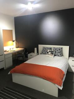 Well-presented double bedroom with a modern dar...