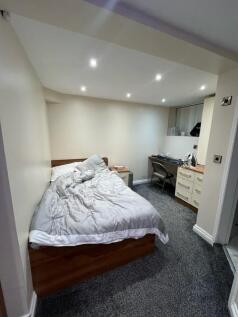Well-appointed studio bedroom with a double bed...