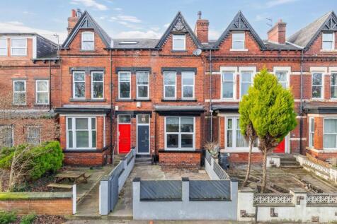 Attractive red-brick terraced house with a brig...