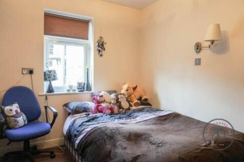 Cozy furnished bedroom with a double bed, soft ...