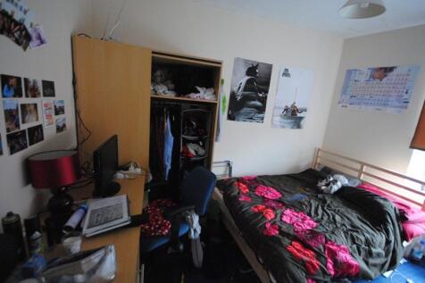 Welcoming, furnished bedroom with a double bed,...