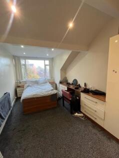 Bright double bedroom with a windowed alcove, f...