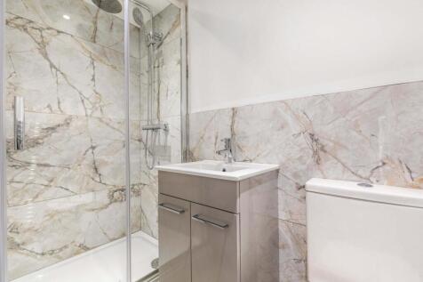 Modern bathroom with a walk-in shower, contempo...