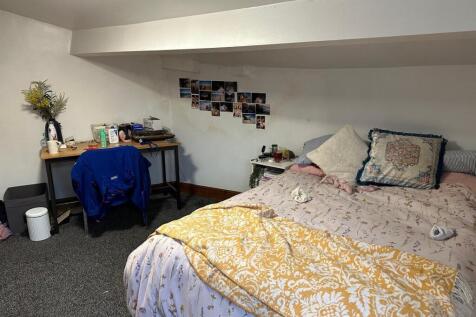 A cozy bedroom with a double bed, decorated wit...