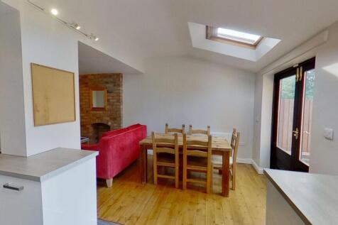 Bright open-plan living and dining area with wo...