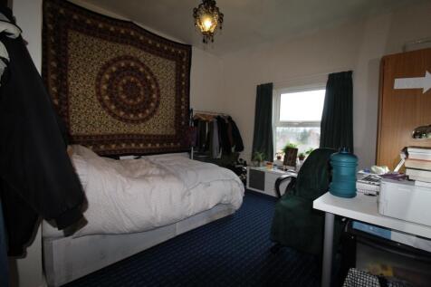 Bright, cozy bedroom with a comfortable double ...