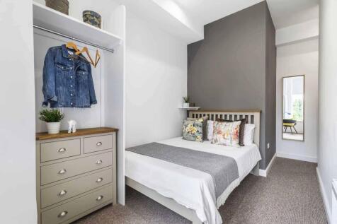 Bright, neatly styled bedroom with a double bed...