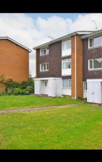 Well-kept mid-rise apartment building with neat...