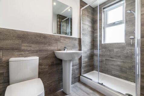 Contemporary bathroom with a walk-in shower, pe...