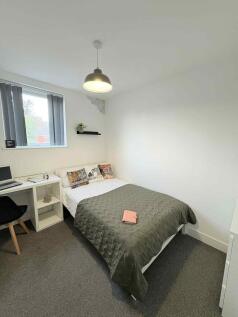 Bright, neatly presented bedroom with a double ...