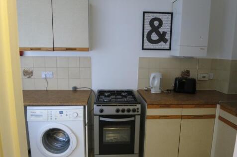 A tidy and functional kitchenette equipped with...