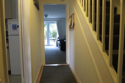 A spacious and well-maintained hallway leading ...