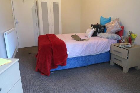 Bright, neatly presented bedroom with a comfort...