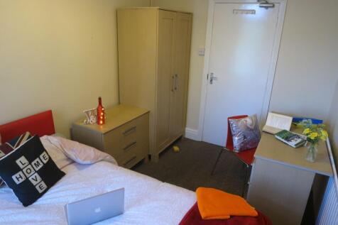 Neat single bedroom with a comfortable bed, bed...