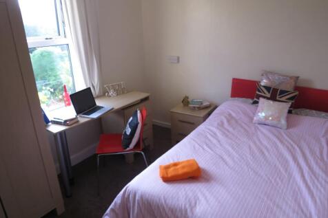 Bright, neatly presented bedroom with a double ...