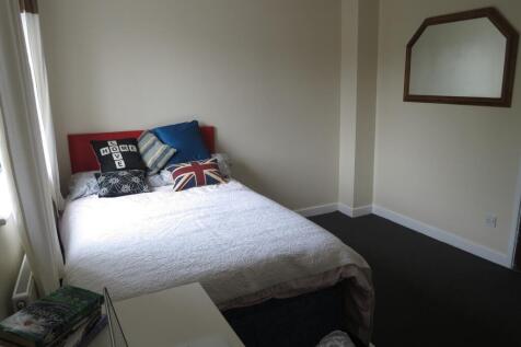 A bright and inviting double bedroom featuring ...