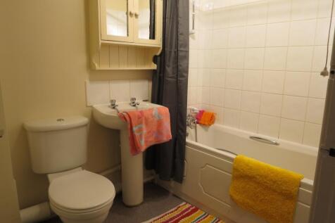 A tidy and well-maintained bathroom featuring a...